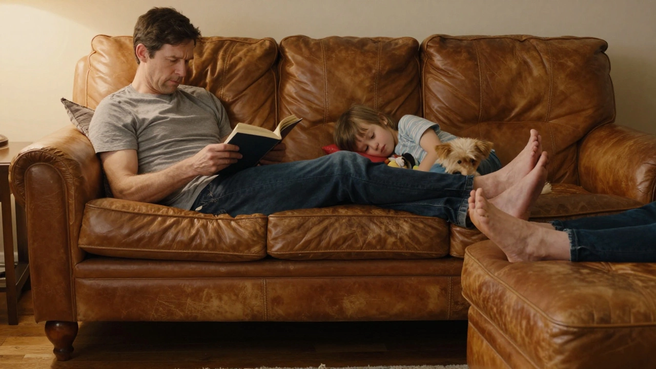 A family relaxing on a well-worn leather sofa with a pet, bathed in warm evening light.