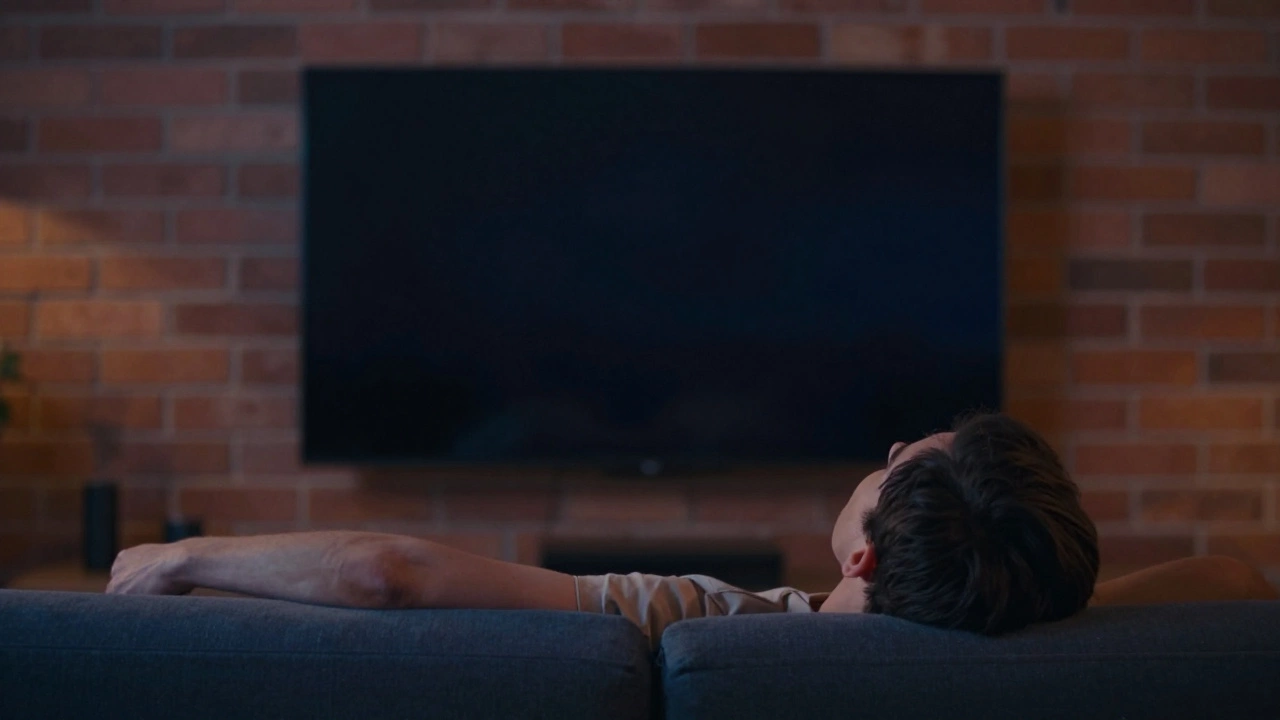 Side view of person sitting on sofa with eyes aligned to center of mounted TV screen